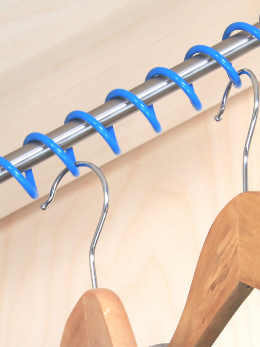 Close up of Zebedee blue clothes rail with multiple hooks holding wooden hangers, showing the product's scale and the type of items it can hold.