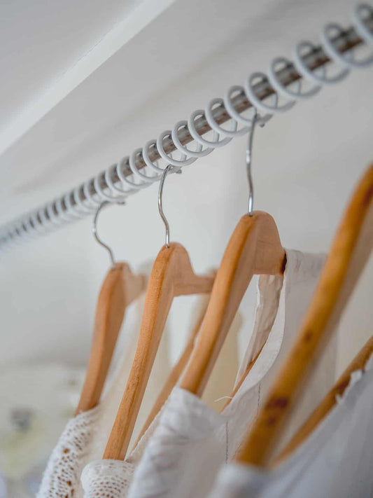 close up of an eaves fitted wardrobe rail, showcasing a neat and organized angled closet.
