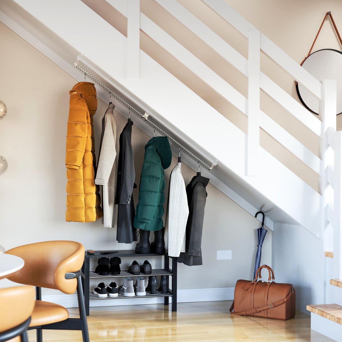 Clothes rail for sloping ceiling top mounted under the stairs for coats storage with a shoe rack and dining chairs.