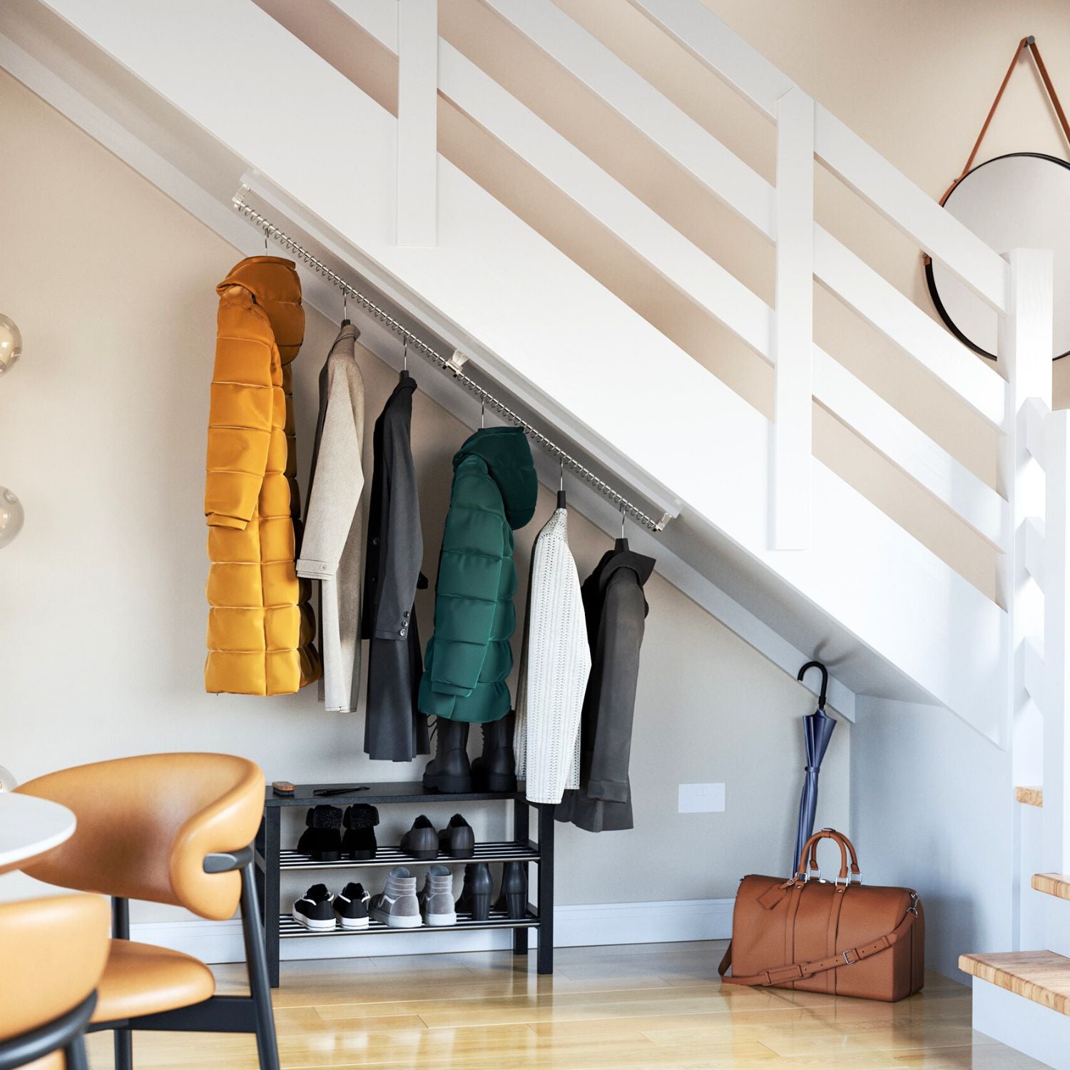 Clothes rail for sloping ceiling top mounted under the stairs for coats storage with a shoe rack and dining chairs.
