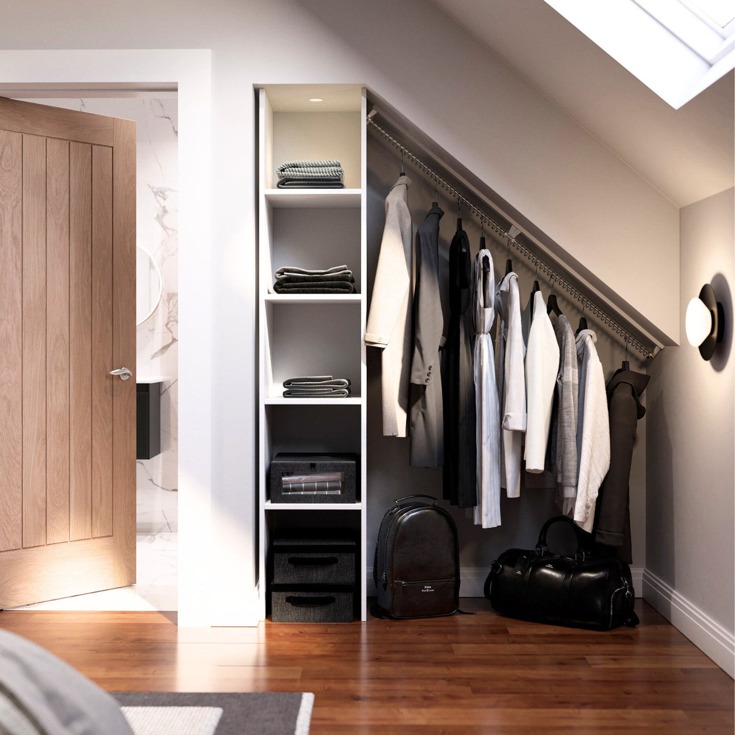 Modern open closet in a loft conversion bedroom with shelves, clothes hanging on an angled rack, and bags on the floor.