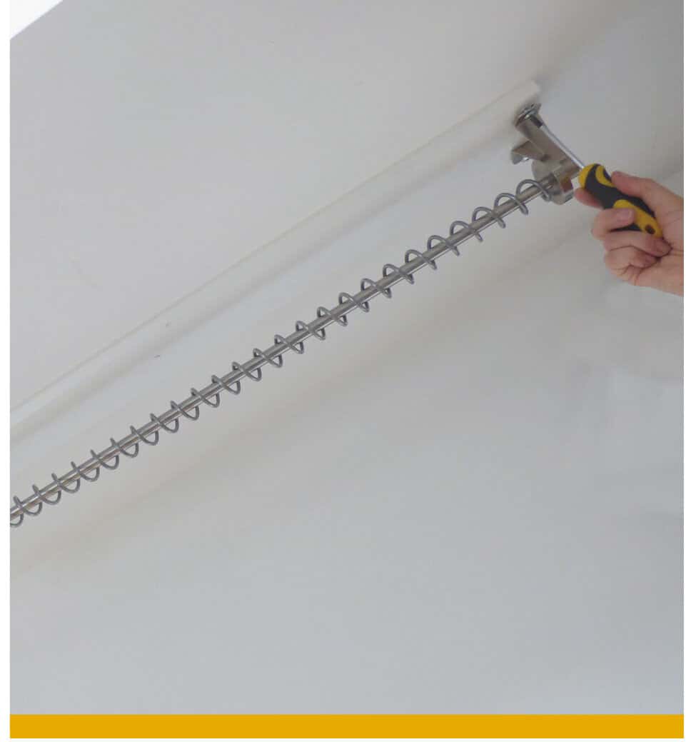 The brackets from the last image, not with the railing added and a hand screwing the bracket in place.