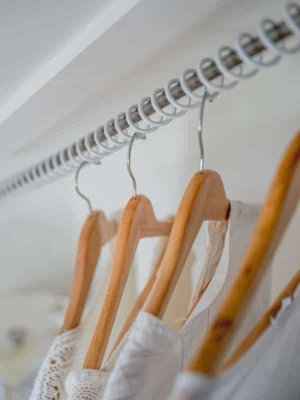 Zebedee Any Angle Hanging Rail - White - shown with clothes hangers